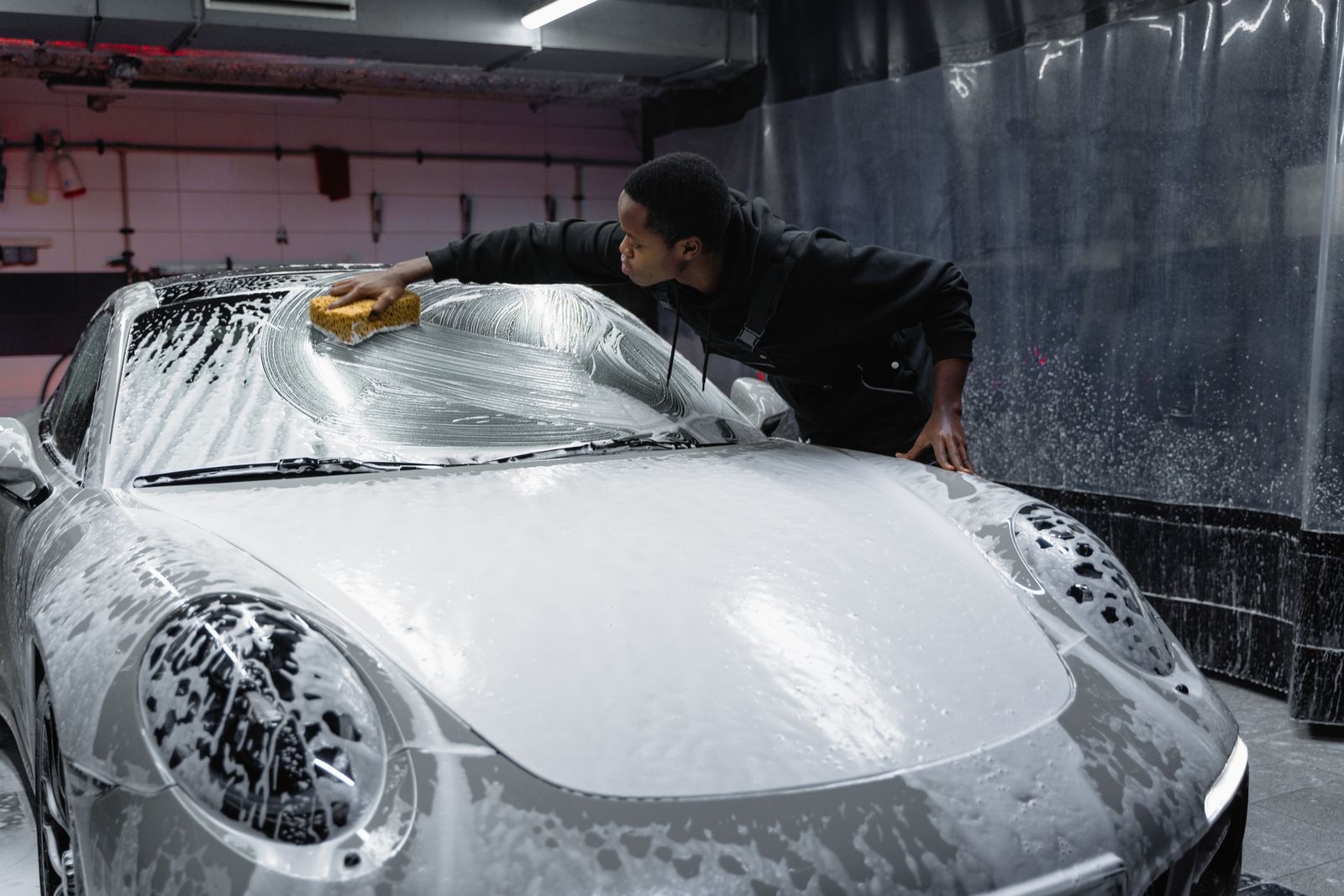 Foam wash on a Porsche hood before decontamination