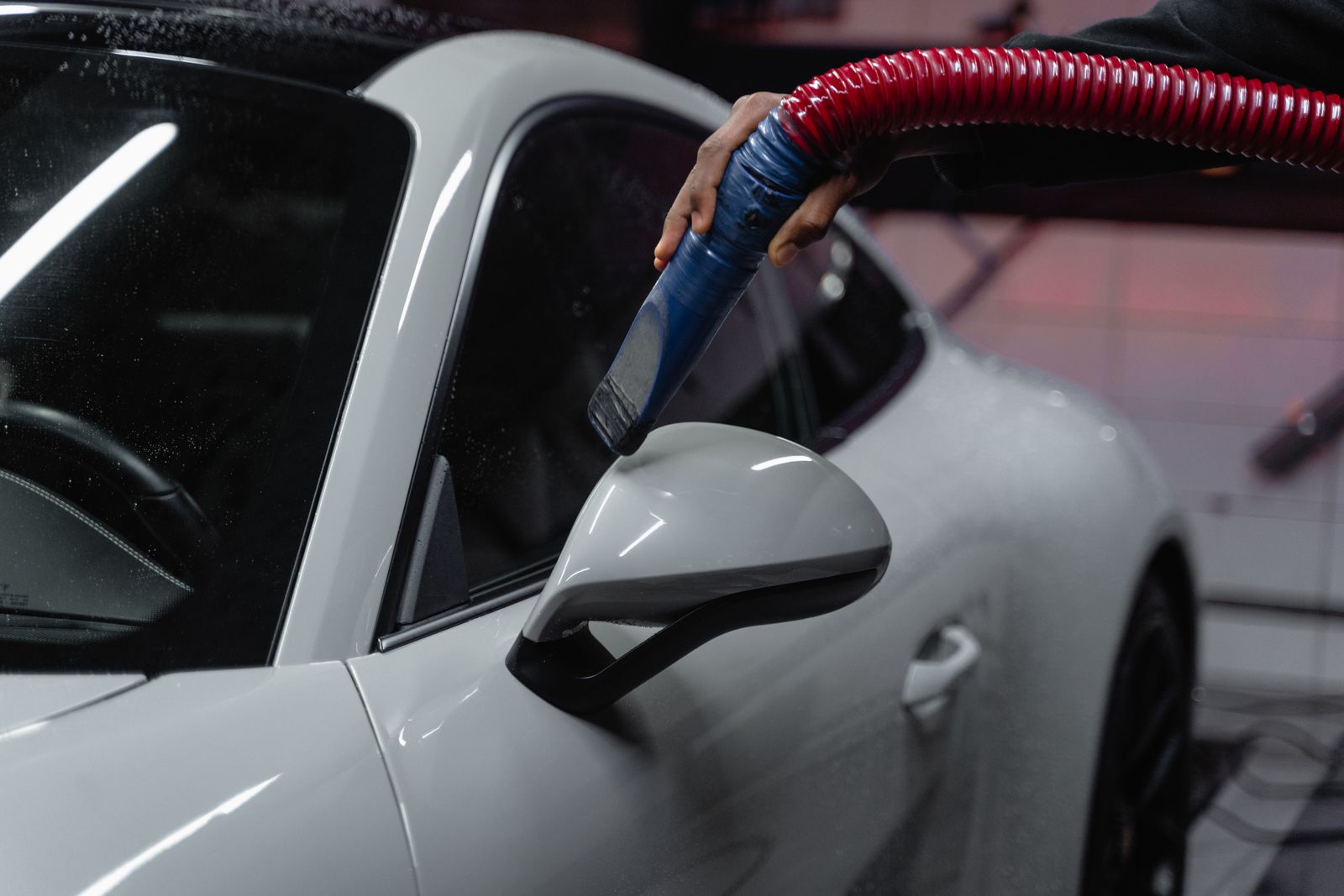 Air-drying a white Porsche after the wash